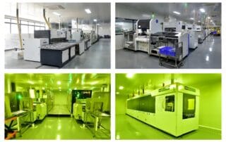 Row of large automated manufacturing machines in a clean, well‑lit production hall