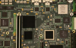 Populated circuit board with integrated circuits, connectors and dense component placement