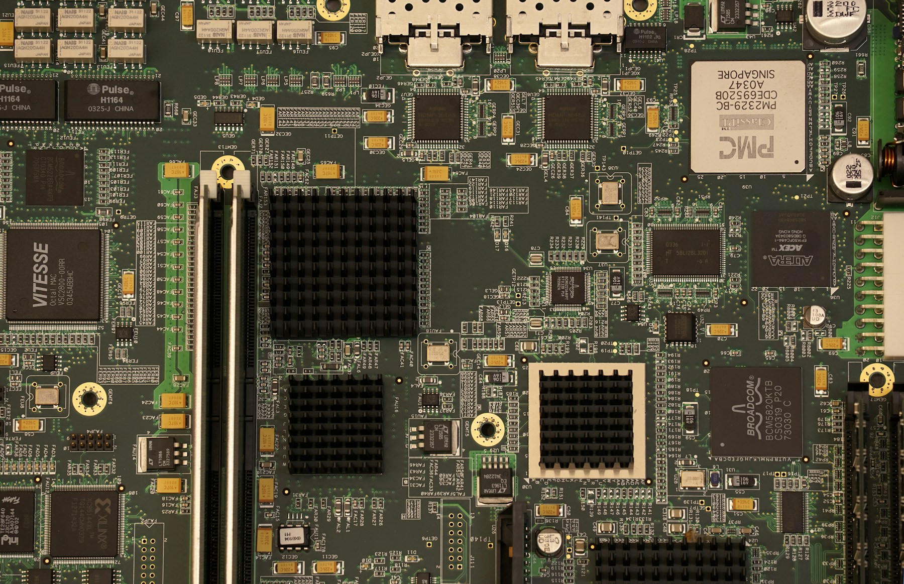 Populated circuit board with integrated circuits, connectors and dense component placement